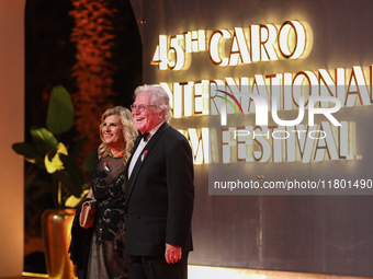 Movie stars Hassen Fahmiii and his wife appear on the red carpet at the conclusion of the Cairo Film Festival in its 45th session, held at t...