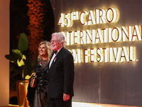 Movie stars Hassen Fahmiii and his wife appear on the red carpet at the conclusion of the Cairo Film Festival in its 45th session, held at t...