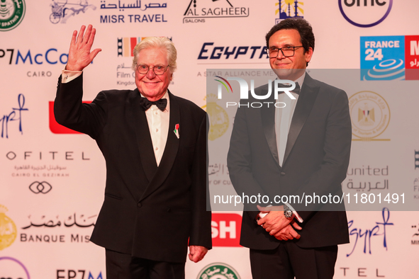 Movie stars Hassen Fahmiii and the Egyptian Minister of Culture stand on the red carpet at the conclusion of the Cairo Film Festival in its...