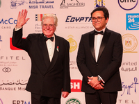 Movie stars Hassen Fahmiii and the Egyptian Minister of Culture stand on the red carpet at the conclusion of the Cairo Film Festival in its...