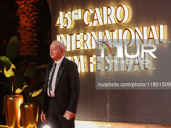 Businessman Naguib Sawiris stands on the red carpet at the conclusion of the Cairo Film Festival in its 45th session, held at the Egyptian O...