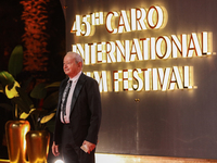 Businessman Naguib Sawiris stands on the red carpet at the conclusion of the Cairo Film Festival in its 45th session, held at the Egyptian O...