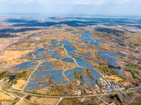 The photovoltaic power array area is on the barren hills on both sides of the rural road in Anqiu, China, on November 22, 2024. (