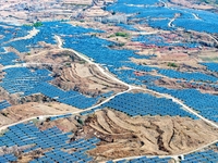 The photovoltaic power array area is on the barren hills on both sides of the rural road in Anqiu, China, on November 22, 2024. (