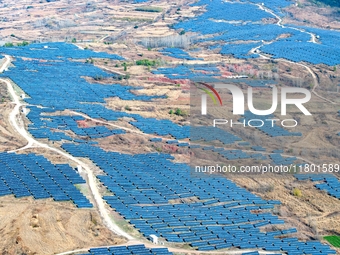 The photovoltaic power array area is on the barren hills on both sides of the rural road in Anqiu, China, on November 22, 2024. (