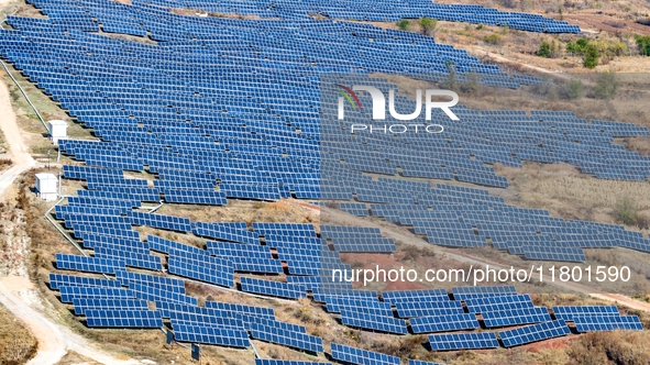 The photovoltaic power array area is on the barren hills on both sides of the rural road in Anqiu, China, on November 22, 2024. 