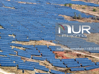 The photovoltaic power array area is on the barren hills on both sides of the rural road in Anqiu, China, on November 22, 2024. (