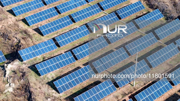 The photovoltaic power array area is on the barren hills on both sides of the rural road in Anqiu, China, on November 22, 2024. 