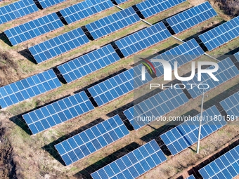 The photovoltaic power array area is on the barren hills on both sides of the rural road in Anqiu, China, on November 22, 2024. (