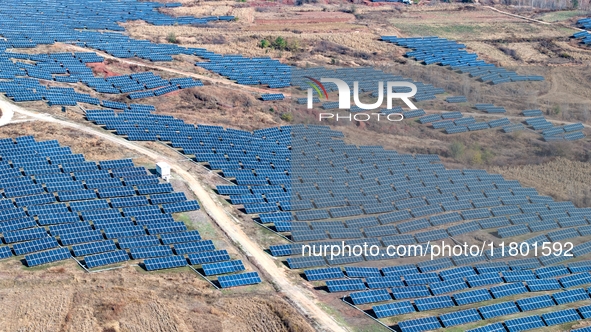 The photovoltaic power array area is on the barren hills on both sides of the rural road in Anqiu, China, on November 22, 2024. 