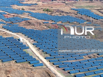 The photovoltaic power array area is on the barren hills on both sides of the rural road in Anqiu, China, on November 22, 2024. (