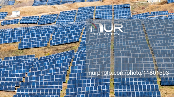 The photovoltaic power array area is on the barren hills on both sides of the rural road in Anqiu, China, on November 22, 2024. 