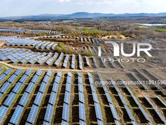 The photovoltaic power array area is on the barren hills on both sides of the rural road in Anqiu, China, on November 22, 2024. (