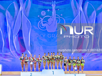 Gold medalists Team Uzbekistan (center), silver medalist Team ROTC (left) from Belarus, and bronze medalist Team ORSS No16 (right) from Russ...