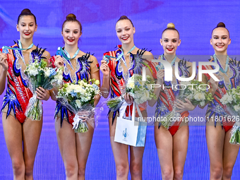 Silver medalist Team ROTC from Belarus celebrates on the podium after the Group Exercises 5 hoops Final of the International Rhythmic Gymnas...