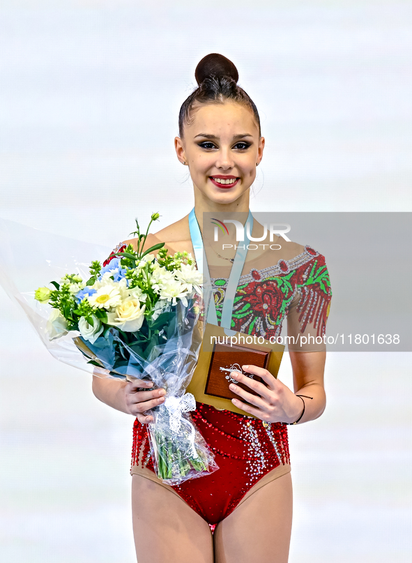 Gold medalist Mariia Borisova of Russia celebrates on the podium after the Individual Rope Final of the International Rhythmic Gymnastics To...