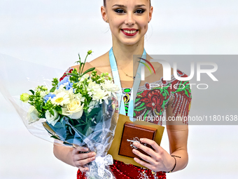 Gold medalist Mariia Borisova of Russia celebrates on the podium after the Individual Rope Final of the International Rhythmic Gymnastics To...