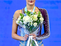 Gold medalist Alina Harnasko of Belarus celebrates on the podium after the Individual Hoop Final of the International Rhythmic Gymnastics To...