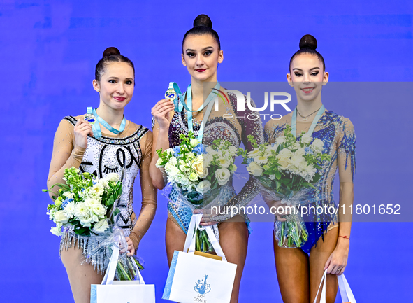 Gold medalists Team Uzbekistan (center), silver medalist Team ROTC (left) from Belarus, and bronze medalist Team ORSS No16 (right) from Russ...