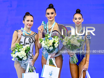 Gold medalists Team Uzbekistan (center), silver medalist Team ROTC (left) from Belarus, and bronze medalist Team ORSS No16 (right) from Russ...