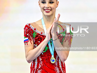 Silver medalist Mariia Borisova of Russia celebrates on the podium after the Individual Ball Final of the International Rhythmic Gymnastics...