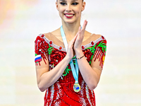 Silver medalist Mariia Borisova of Russia celebrates on the podium after the Individual Ball Final of the International Rhythmic Gymnastics...