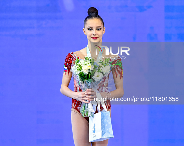 Silver medalist Mariia Borisova of Russia celebrates on the podium after the Individual Ball Final of the International Rhythmic Gymnastics...