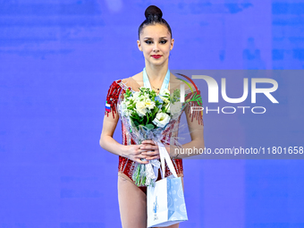 Silver medalist Mariia Borisova of Russia celebrates on the podium after the Individual Ball Final of the International Rhythmic Gymnastics...