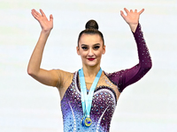 Gold medalists Team Uzbekistan (center) and silver medalist Team ROTC (left) from Belarus participate in the clubs final of the Internationa...