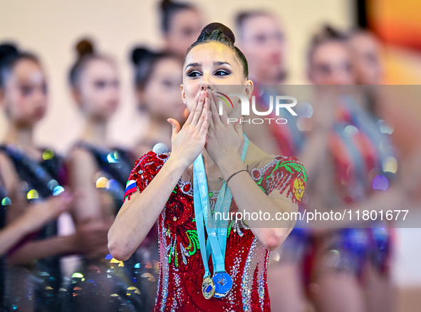 Gold medalist Mariia Borisova of Russia celebrates on the podium after the Individual All-Around Rhythmic Gymnastics Final of the Internatio...