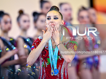 Gold medalist Mariia Borisova of Russia celebrates on the podium after the Individual All-Around Rhythmic Gymnastics Final of the Internatio...