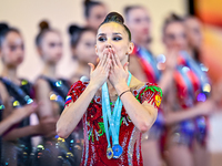 Gold medalist Mariia Borisova of Russia celebrates on the podium after the Individual All-Around Rhythmic Gymnastics Final of the Internatio...