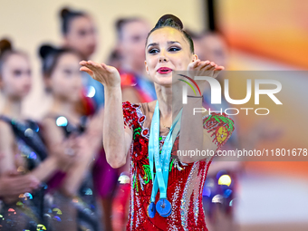 Gold medalist Mariia Borisova of Russia celebrates on the podium after the Individual All-Around Rhythmic Gymnastics Final of the Internatio...