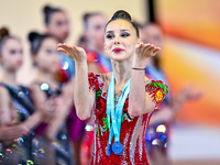 Gold medalist Mariia Borisova of Russia celebrates on the podium after the Individual All-Around Rhythmic Gymnastics Final of the Internatio...