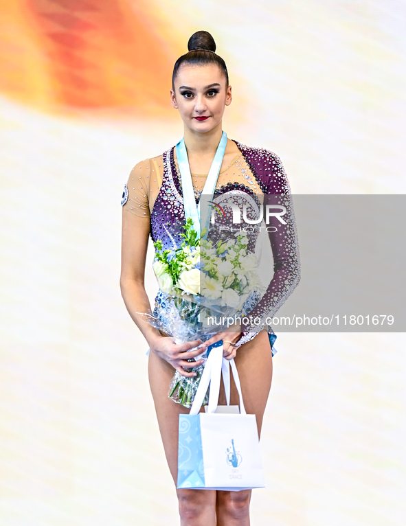 Silver medalist Alina Harnasko of Belarus celebrates on the podium after the Individual Ribbon Final of the International Rhythmic Gymnastic...