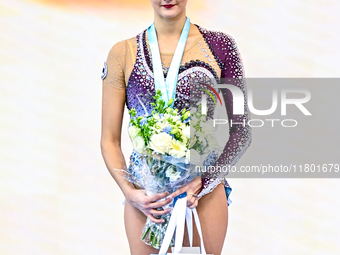 Silver medalist Alina Harnasko of Belarus celebrates on the podium after the Individual Ribbon Final of the International Rhythmic Gymnastic...