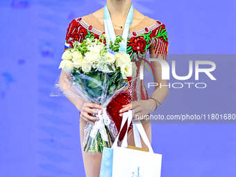 Gold medalist Mariia Borisova of Russia celebrates on the podium after the Individual Ribbon Final of the International Rhythmic Gymnastics...