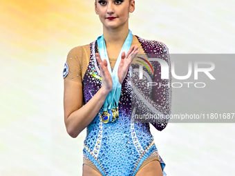 Silver medalist Alina Harnasko of Belarus celebrates on the podium after the Individual All-Around Rhythmic Gymnastics Final of the Internat...