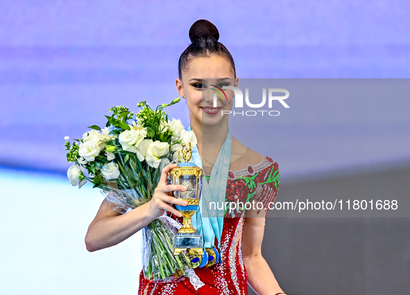 Gold medalist Mariia Borisova of Russia celebrates on the podium after the Individual All-Around Rhythmic Gymnastics Final of the Internatio...