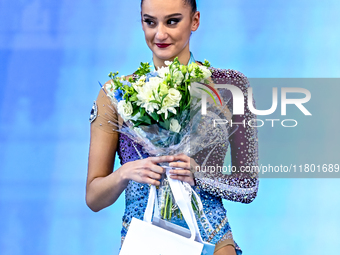 Silver medalist Alina Harnasko of Belarus celebrates on the podium after the Individual All-Around Rhythmic Gymnastics Final of the Internat...