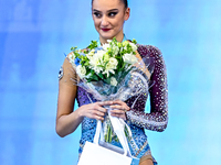 Silver medalist Alina Harnasko of Belarus celebrates on the podium after the Individual All-Around Rhythmic Gymnastics Final of the Internat...