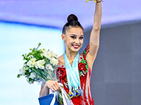 Gold medalist Mariia Borisova of Russia celebrates on the podium after the Individual All-Around Rhythmic Gymnastics Final of the Internatio...