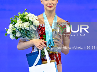 Gold medalist Mariia Borisova of Russia celebrates on the podium after the Individual All-Around Rhythmic Gymnastics Final of the Internatio...