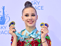 Gold medalist Mariia Borisova of Russia celebrates on the podium after the Individual All-Around Rhythmic Gymnastics Final of the Internatio...