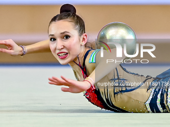 Takhmina Ikromova of Uzbekistan competes in the Ball final of the International Rhythmic Gymnastics Tournament 'Sky Grace 2024' at Aspire Zo...