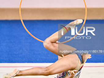 Aibota Yertaikyzy of Kazakhstan competes in the Hoop final of the International Rhythmic Gymnastics Tournament 'Sky Grace 2024' at Aspire Zo...