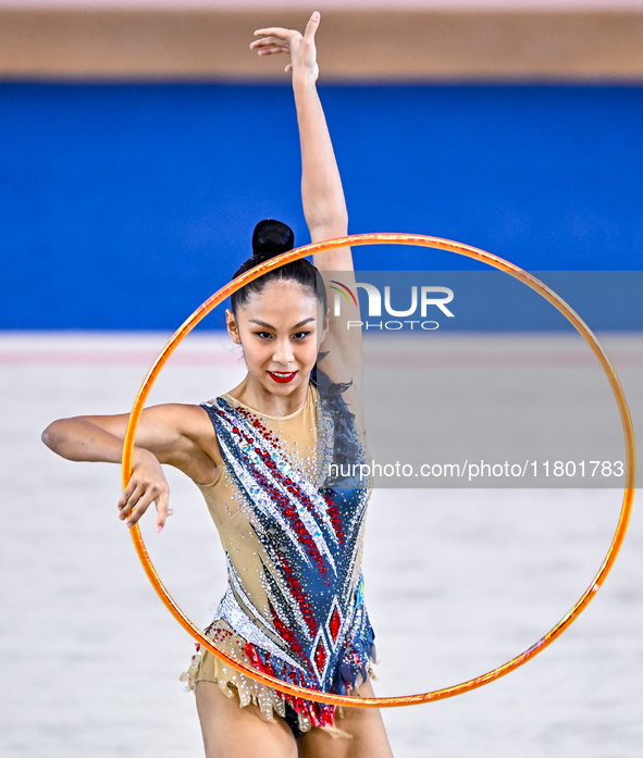 Aibota Yertaikyzy of Kazakhstan competes in the Hoop final of the International Rhythmic Gymnastics Tournament 'Sky Grace 2024' at Aspire Zo...