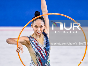 Aibota Yertaikyzy of Kazakhstan competes in the Hoop final of the International Rhythmic Gymnastics Tournament 'Sky Grace 2024' at Aspire Zo...