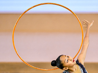 Aibota Yertaikyzy of Kazakhstan competes in the Hoop final of the International Rhythmic Gymnastics Tournament 'Sky Grace 2024' at Aspire Zo...