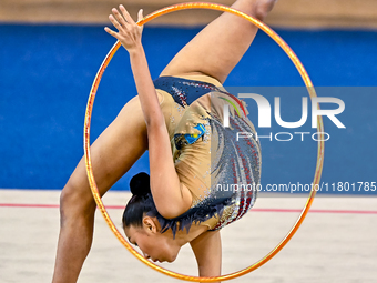 Aibota Yertaikyzy of Kazakhstan competes in the Hoop final of the International Rhythmic Gymnastics Tournament 'Sky Grace 2024' at Aspire Zo...